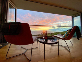 Sunset Waves Sea view apartment featuring panoramic views & parking